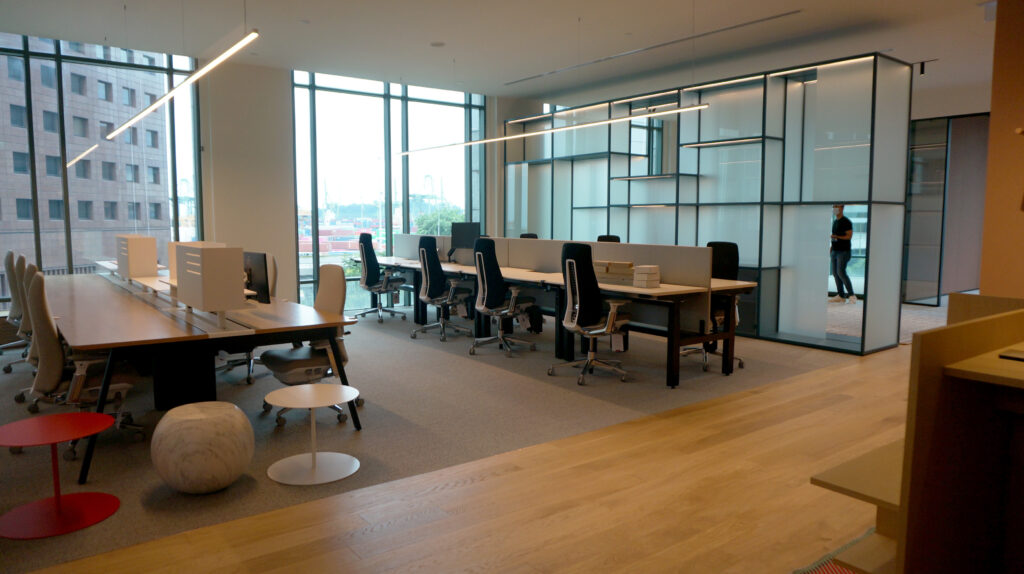 An interior fit-out with glass windows and an eccentric glass partition