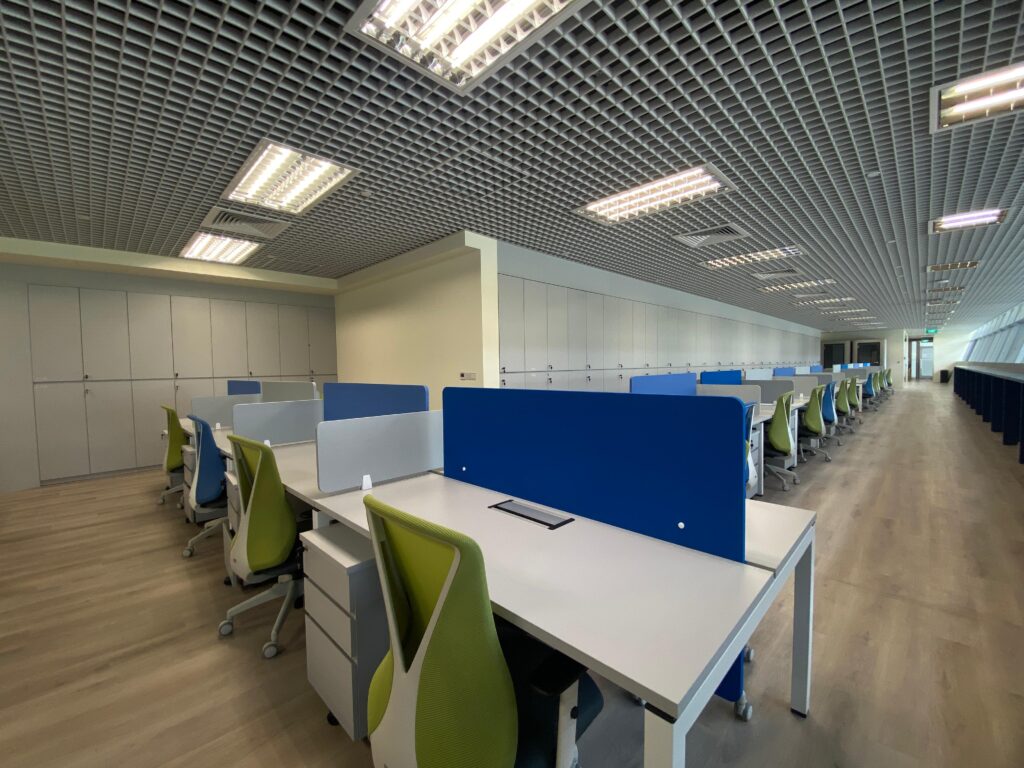 An office interior fit-out featuring blue and green brand colours