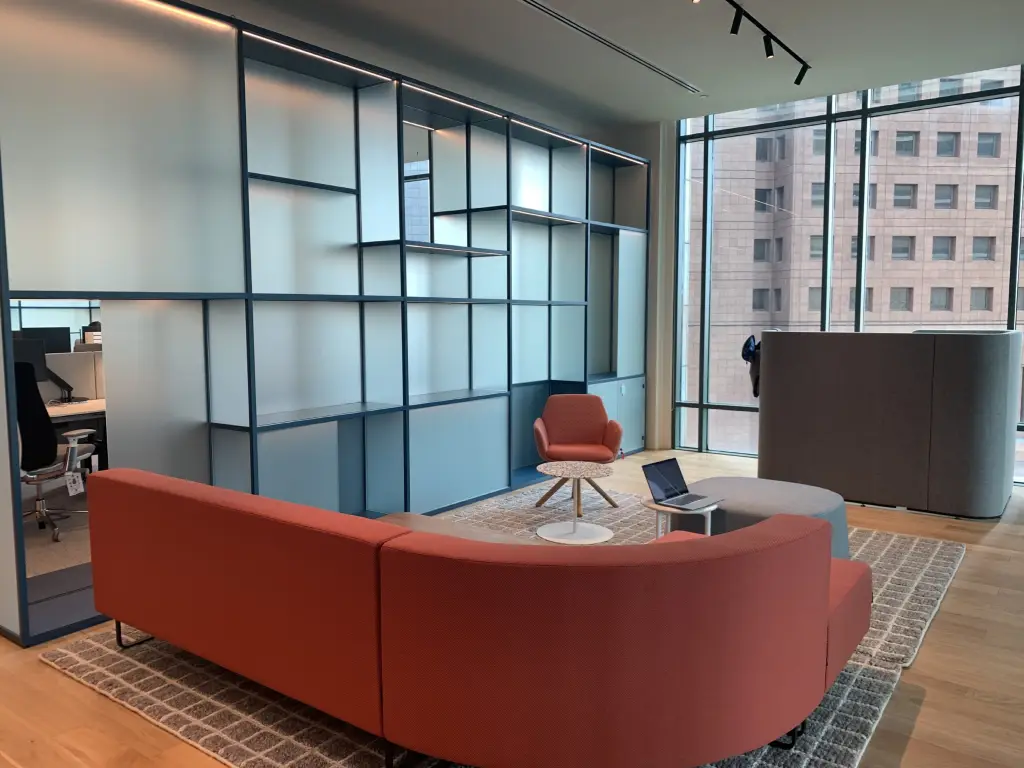  Modern workspace with sustainable furniture, natural lighting, and energy-efficient design created by a professional office renovation company.