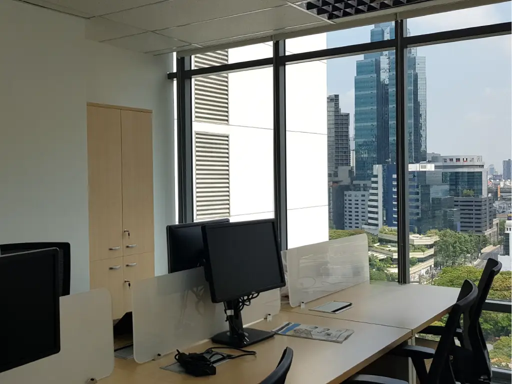 fit-out contractor office workspace in Thailand with natural light and city views