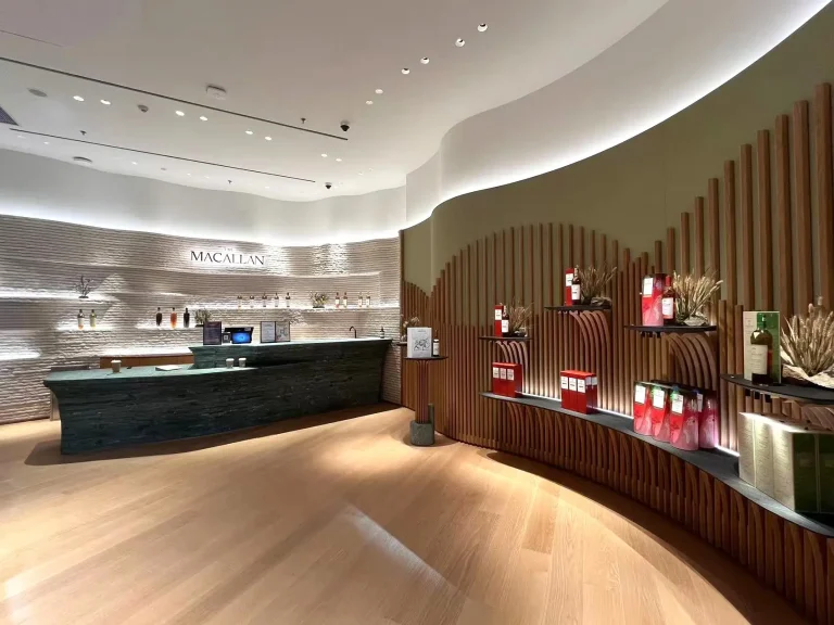 The Macallan store interior at Raffles Hotel, a project by a shop fit-out contractor in Singapore"